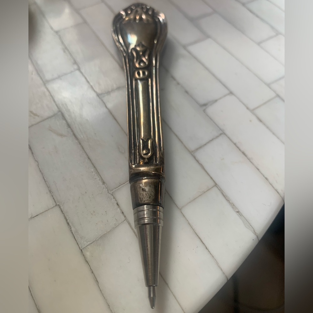 Silver ware pen with blue ink comes with a Velcro fabric pouch